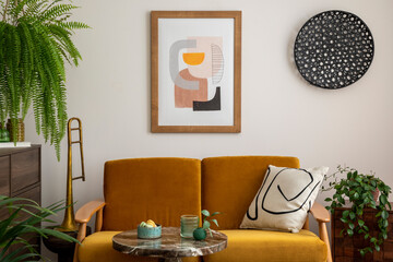 Retro and scandi style interior of living room with yellow sofa, mock up poster frame, coffee...