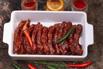 pork ribs marinated in honey mustard sauce and paprika, for barbecue