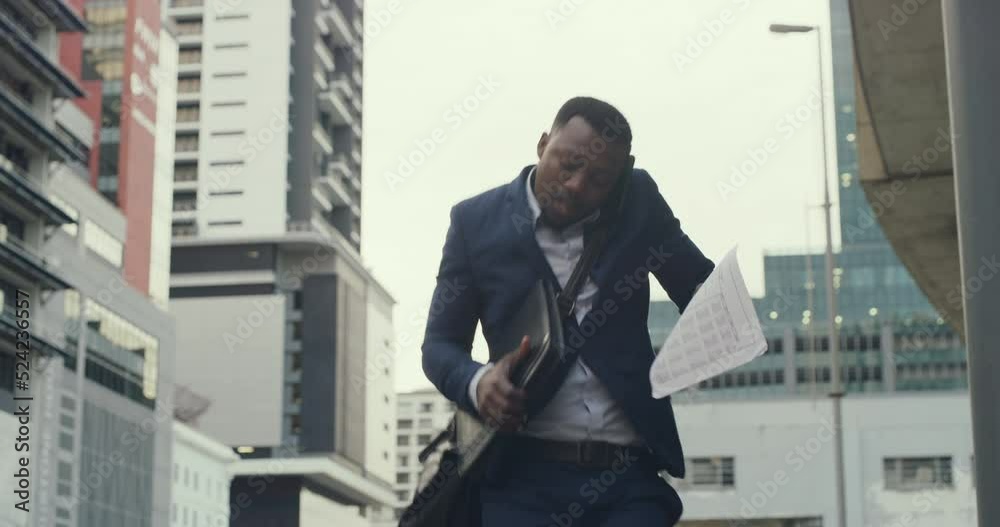 Poster a busy corporate businessman on a phone call drops his laptop while walking in the city. clumsy, sil