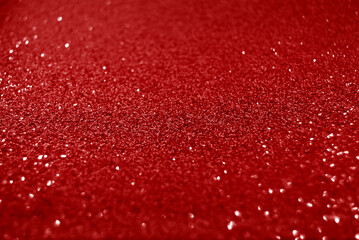 Red de focused sparkle glitter background
