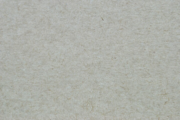 Recycled paper texture, a sheet of gray recycled cardboard texture as background
