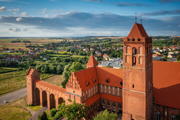 The castle and cathedral in Kwidzyn illuminated by the setting sun, Poland