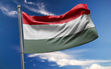 Fototapeta na wymiar Hungarian Flag is Waving Against Blue Sky with Clouds