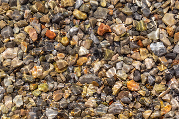 Colorful stones background in the sea