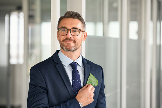 Businessman with green leaf in pocket