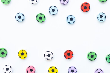 Naklejka premium Wooden figures in the form of soccer balls on a white background
