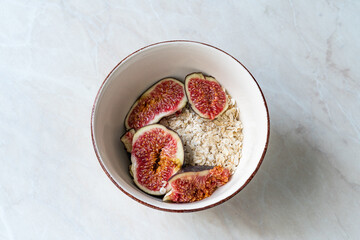 Muesli cereal mix with oatmeal, fig and almond milk.