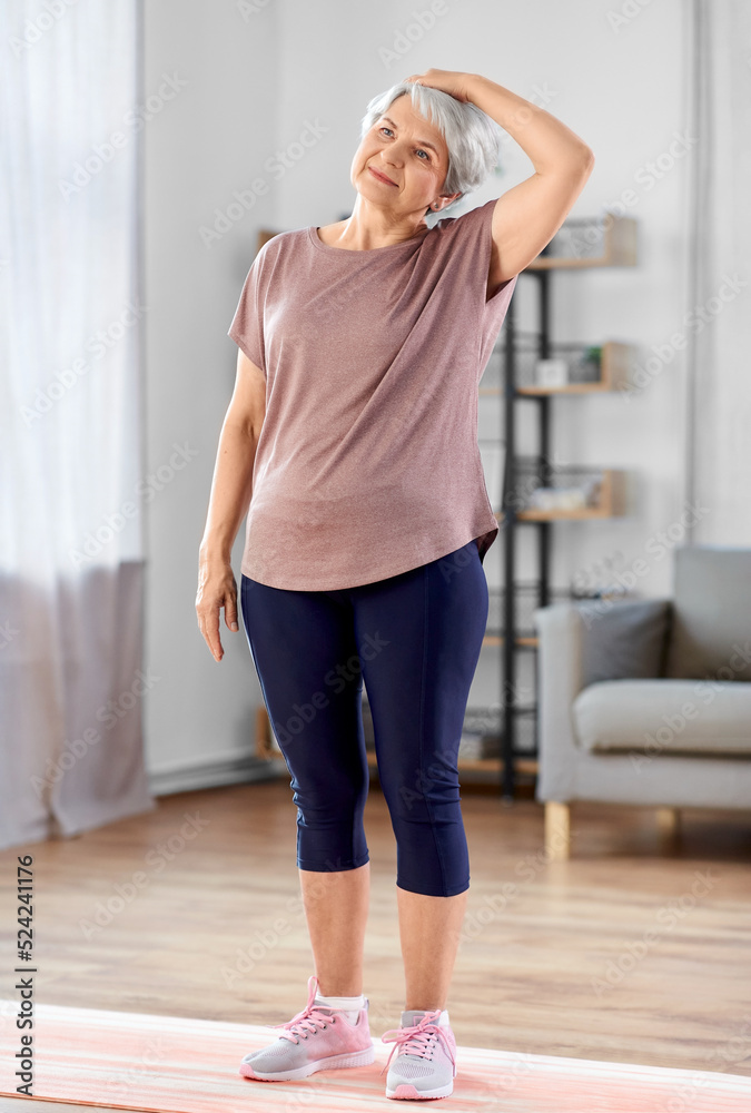 Canvas Prints sport, fitness and healthy lifestyle concept - smiling senior woman exercising on mat at home