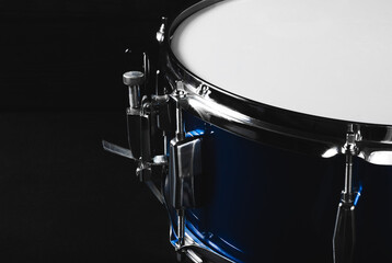 Fototapeta na wymiar Snare drum in backlight. Musical instrument. Drum in low key.