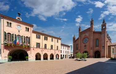Cathedral of San Lorenzo and the town hall with historic buildings in Piazza Duomo in Alba, Langhe,...