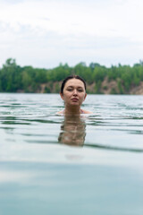 Portrait of a girl of Caucasian appearance in the lake.