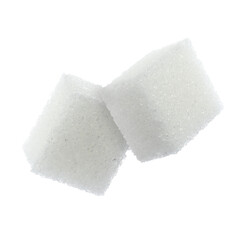 Flying cubes of sugar on white background