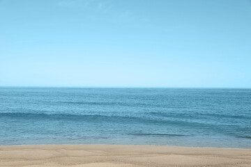 Picturesque view of sandy beach near sea