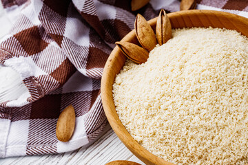 almond flour on a white wooden rustic background