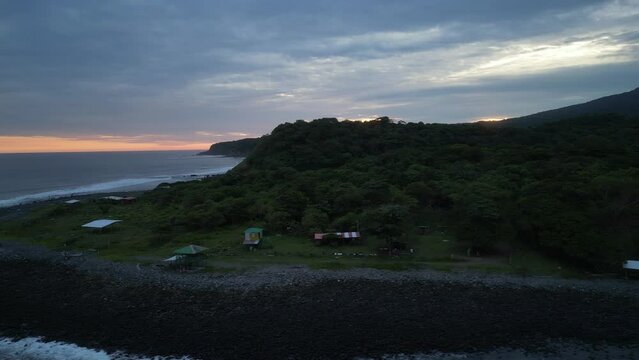 Drone shot of sunset and volcano island.