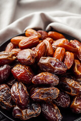 juicy royal dates on a black wooden rustic background