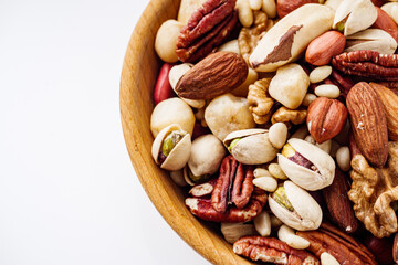 set of different nuts on a white acrylic background