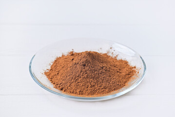 glass plate flour cocoa. white table.