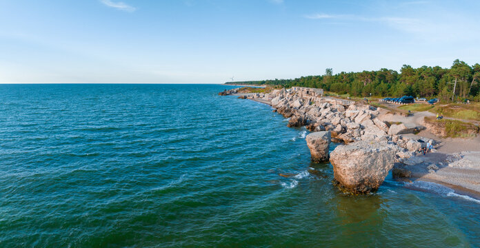 Ruins of bunkers on the beach of the Baltic sea, part of an old fort in the former Soviet base Karosta in Liepaja, Latvia. Sunset landscape.