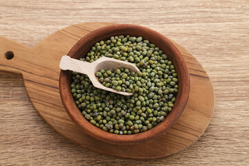 Group of green mung beans served on wooden bowl. Food preparation