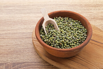 Group of green mung beans served on wooden bowl. Food preparation