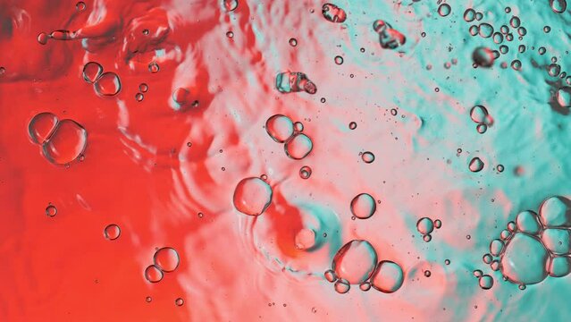 Super slow motion of water surface on light blue background. Filmed on high speed cinema camera, 1000 fps.
