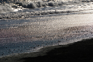 Reynisfjara - black beach in Iceland, close-up on waves