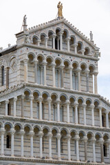 Obraz premium Facade of medieval Pisa Cathedral in the Piazza del Duomo, next to Leaning Tower of Pisa and Pisa Baptistery of St. John, Pisa, Italy.