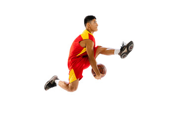 Portrait of young man, basketball player isolated over white studio background. High jump with ball