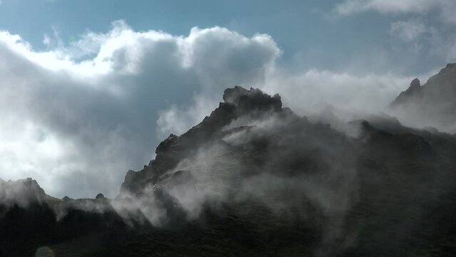 Steam emitting from fumarole in geothermal area of Hverir. Sulphur dioxide erupting from volcanic crater at Namafjall. Geyser in famous tourist attraction in Iceland