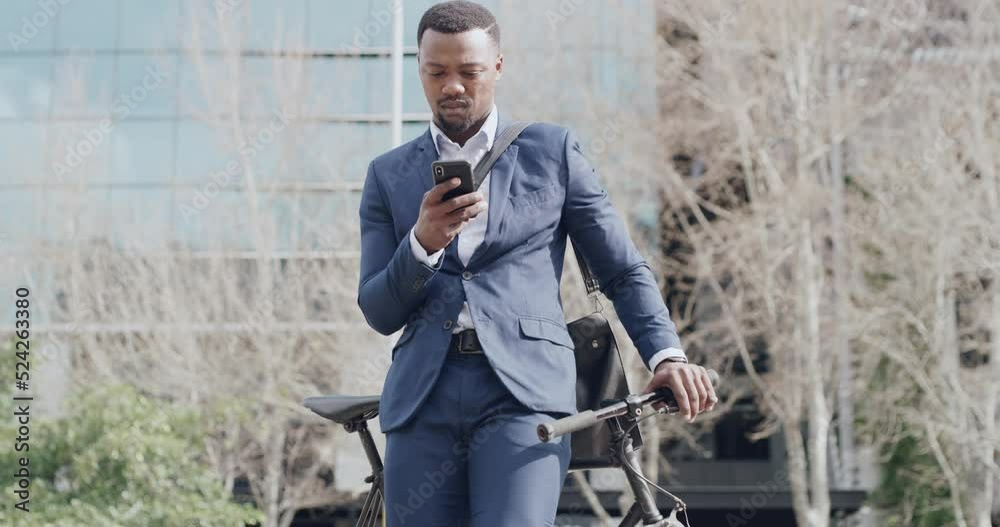 Canvas Prints Serious, corporate and reading business man looking at text on phone, commuting to work with bicycle and searching for location in the city. Young, professional and black employee looking at gps