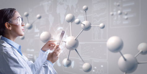 Young chemist technician touching tablet computer and examining molecular data online displayed on...