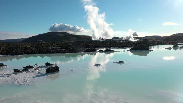Steam emitting from fumarole in geothermal area of Hverir. Sulphur dioxide erupting from volcanic crater at Namafjall. Geyser in famous tourist attraction in Iceland