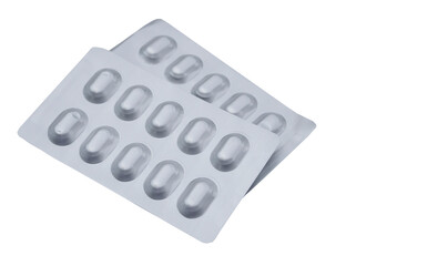 Silver aluminum blister packages of capsule pills medicine isolated on white background. Concept : Pharmaceutical packaging manufacturing medicine. Pharmacy.