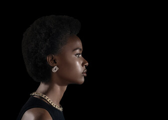 Young black woman profile beauty portrait on dark background.