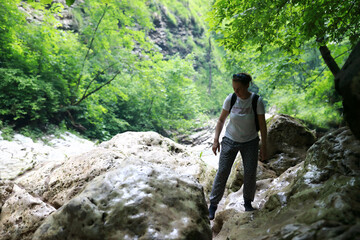 Portrait of woman walking along canyon path to Rufabgo Waterfalls