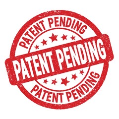 PATENT PENDING text written on red round stamp sign.