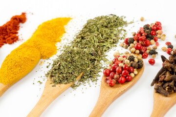 Top view mix spices and herbs different size terracotta pots on white background with copy space for design vegetables, healthy lifestyle, spices, herbs or foods content.