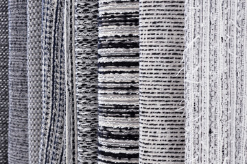 assortment of fabrics in the store for the interior, textiles for tailoring and curtains,...
