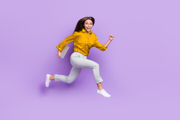 Fototapeta na wymiar Full length profile photo of active carefree person hold netbook rush jump isolated on violet color background