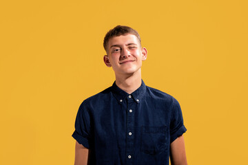 Portrait of enthusiastic attractive guy giving wink isolated on vivid background