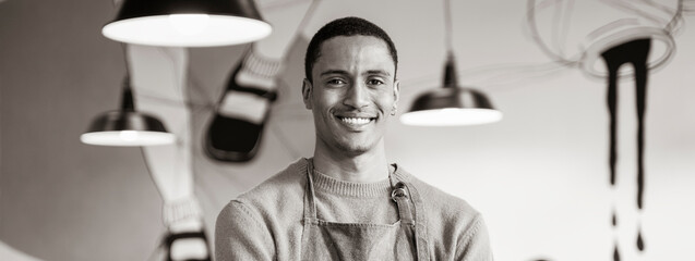 Horizontal banner or header with smiling owner or waiter in work uniform standing in modern...