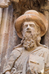 Sculpture of the apostle Santiago in the gothic facade of the cathedral of Murcia