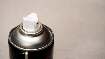 Spray paint can nozzle close up view