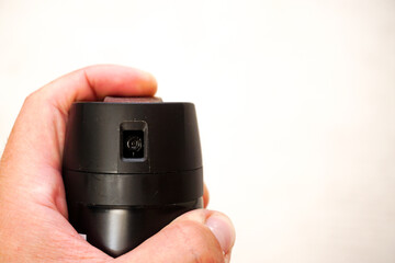 Man pressing on deodorant spray button close up view