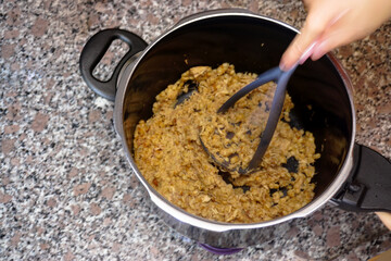 Famous Ottoman meal Keskek made with grain and chicken at home in the kitchen preparation