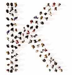 Concept or conceptual large community of people forming the font K. 3d illustration metaphor for unity and diversity, humanitarian, teamwork, cooperation, education, friendship and community