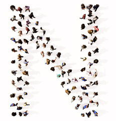 Concept or conceptual large community of people forming the font N. 3d illustration metaphor for unity and diversity, humanitarian, teamwork, cooperation, education, friendship and community