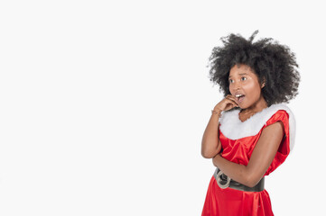 female brunette adult surprised in christmas dress