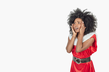 Fototapeta na wymiar amazed african woman with a christmas costume, facial expression